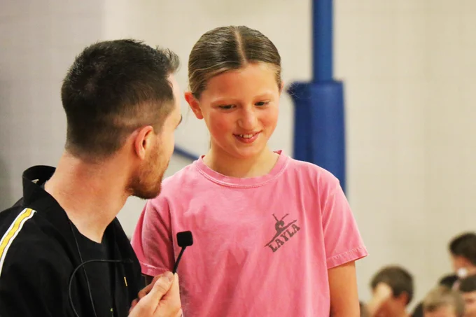 A Rockwood student smiles while participating in a martial arts demonstration.
