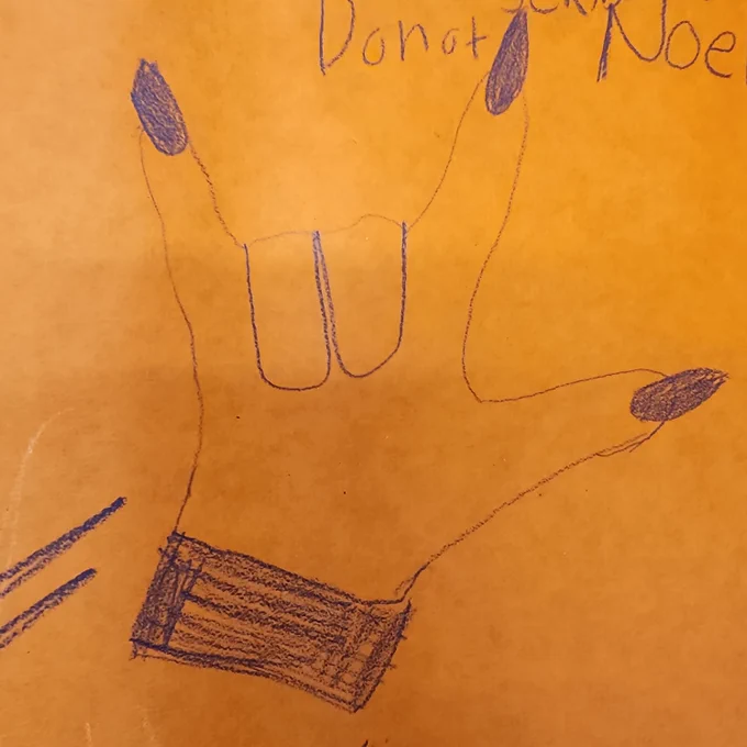 A drawing of the ASL sign for "I love you"