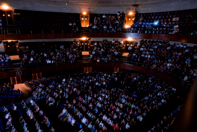 Low lights as a full auditorium in Sheffield City Hall attend the opening night of Docfest 2023