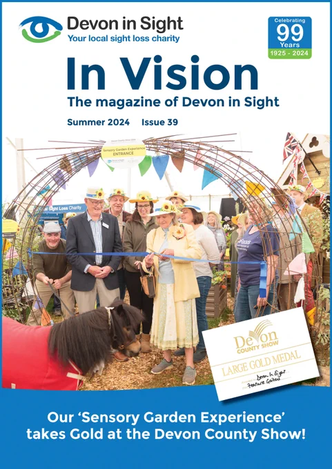 The image is the front cover of the In Vision Magazine. It is a picture of Lady Devon cutting the ribbon of our Sensory Garden with The Chair of Trustees Adrian Jacobs, Grahame Flynn, the Chief Executive and all the staff and many of the sponsors all smiling and wearing our Sunflower hats, which represents the hidden disability. 
The Mayor of Cockington (Patrick the pony) eagerly awaits the opening. The image is all framed by a huge steel archway which marked the entrance to the garden. Passing through an arch is symbolic of the opening of new perspectives and the ability to see beyond the present.
