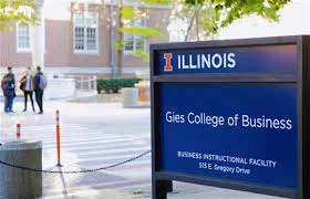 Gies College of Business sign with Wohlers Hall in the background 
