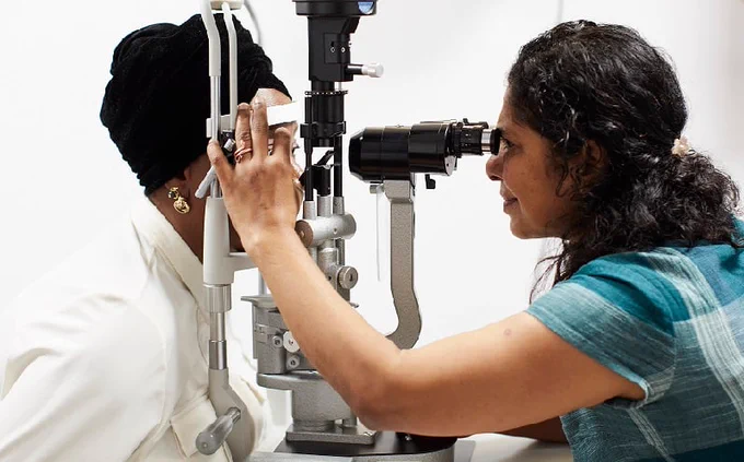 Image of a patient being examined by a consultant.