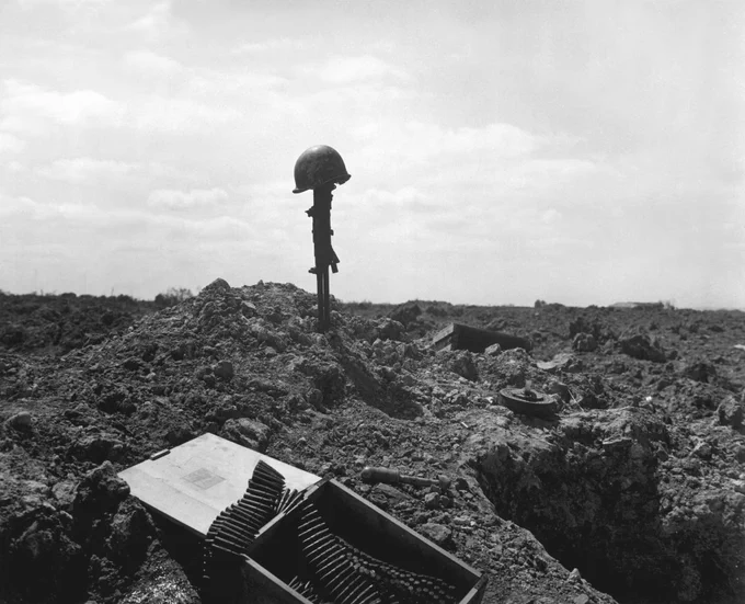 A monument erected to an American Soldier somewhere on the shell-blasted coast of Normandy. Photo Credit: U.S. Coast Guard photo.
