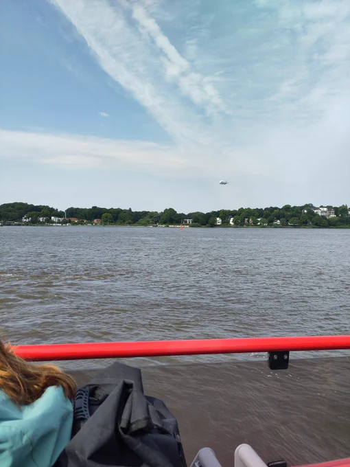 A dolphin-shaped Airbus airplane on its way to Hamburg-Finkenwerder, to the Airbus aircraft manufacturing plant. Nicely visible from our ferry.
