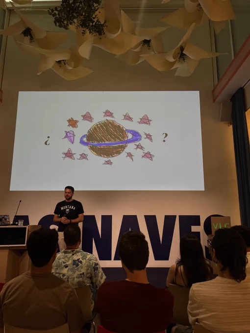 Jordi informing of his slides (illustration of the planet on the screen)