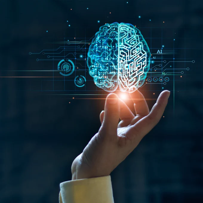 cupped hand facing upwards with a digital hologram of a brain, depicting AI