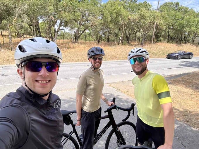 Selfie of Andrew, me and Moritz in front of a road