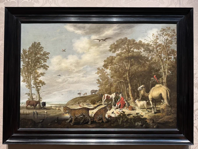 photo of the painting in black frame hanging on display at museum