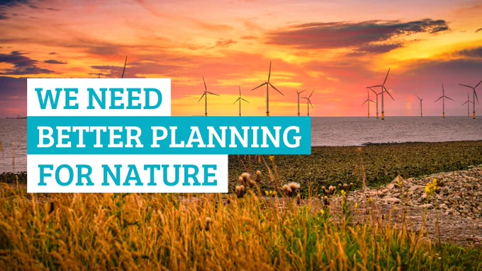 An offshore wind farm, seen off the coast of a grassy beach. Text reads "we need better planning for nature"