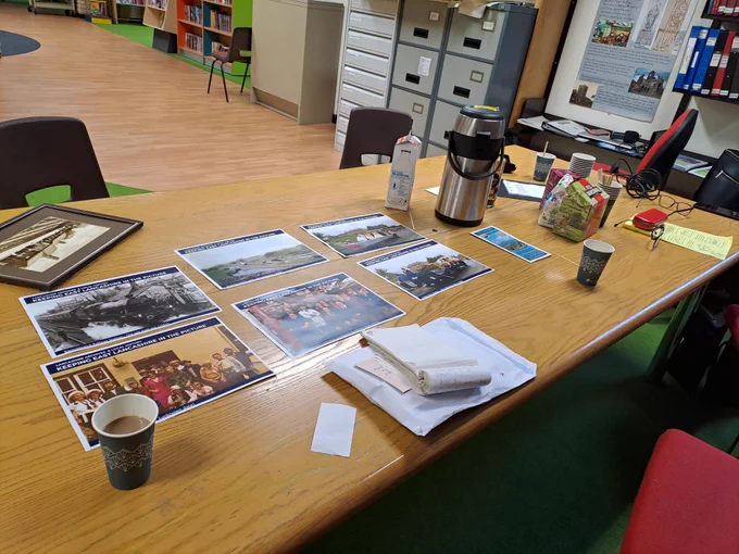 Four colour images showing photographs from the Keeping East Lancashire in the Picture project in Barnoldswick Library, and people looking at them
