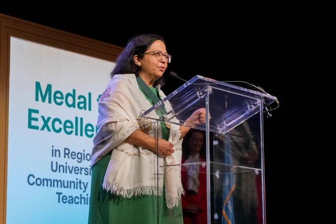Dr. Sapna Das-Bradoo, recipient of OFE's Medal for Excellence in Regional University/Community College Teaching, makes an acceptance speech on stage at the Academic Awards Celebration.