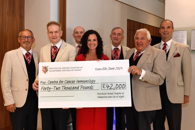 Katherine de Retuerto from the Centre for Cancer Immunology pictured with local Royal Arch Freemasons. 