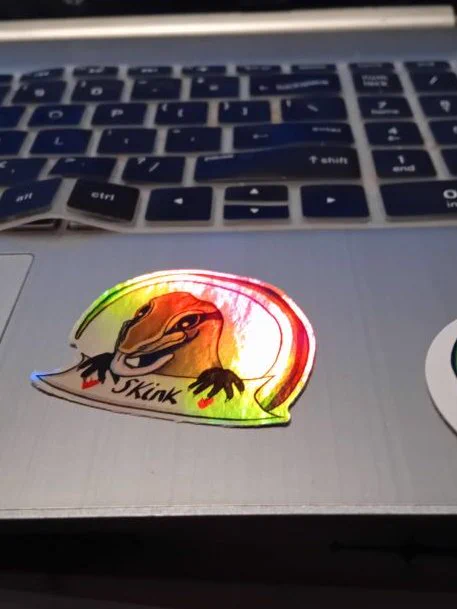 the iridescent sticker shining pink and orange and green
