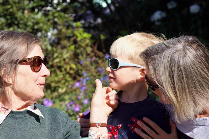 my mother and son enjoying a special moment in the sunshine together