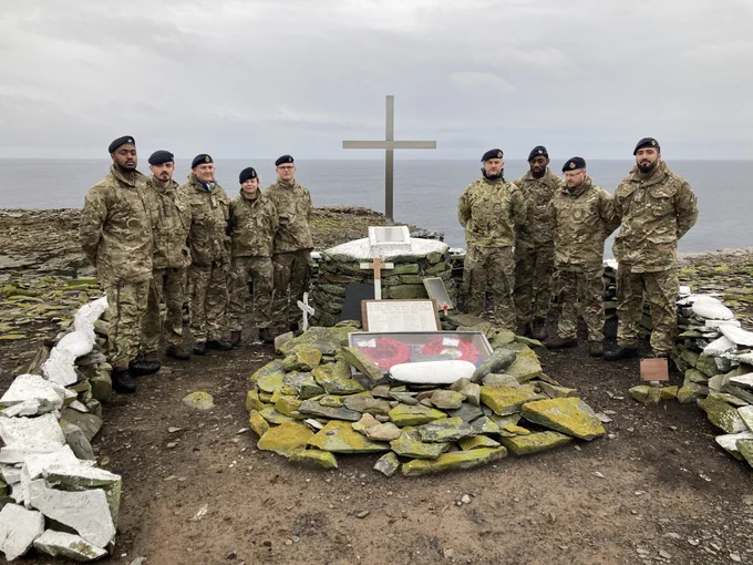 The NEFI engineers with the freshly-restored monument to HMS Sheffield