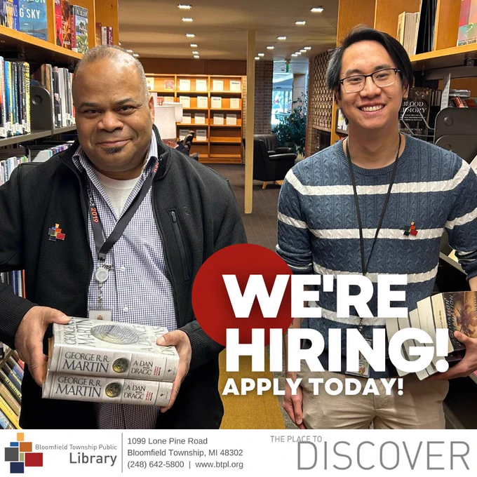 hiring ad with an image of two library workers holding books in the stacks