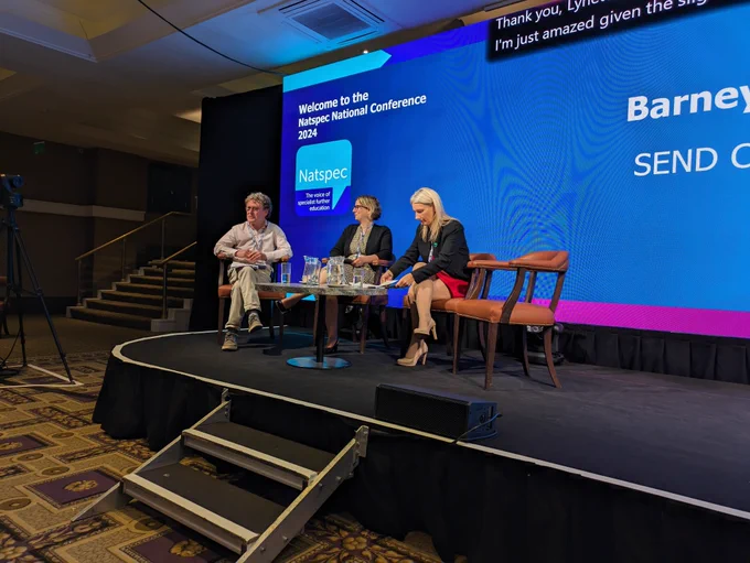 Barney, Katerina and Lynette sitting on the stage.