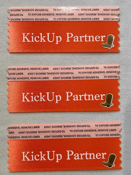KickUp Partner orange ribbon with cowboy boot