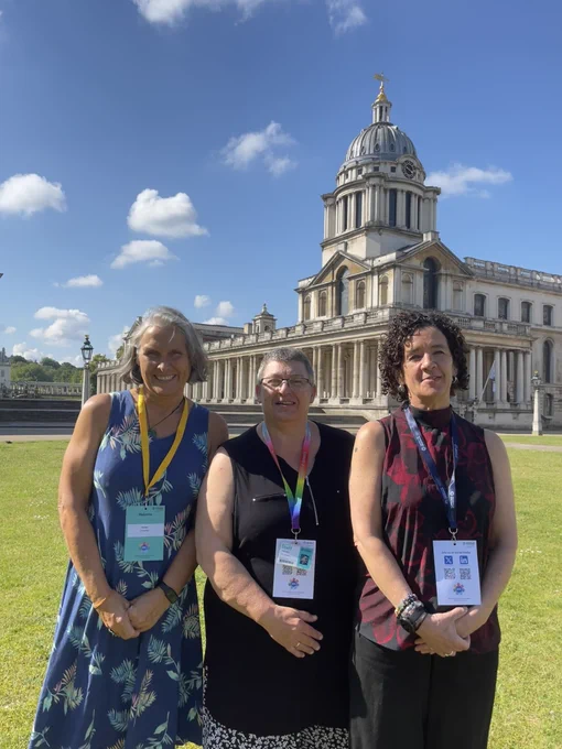 Professor Susan Crowther, Professor Lesley Dibley and Professor Gill Thomson standing in front of Greenwich campus on a sunny day.