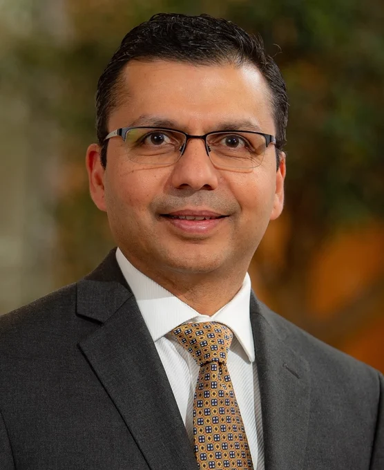 Image shows a photograph of Professor Charuhas V. Thakar.