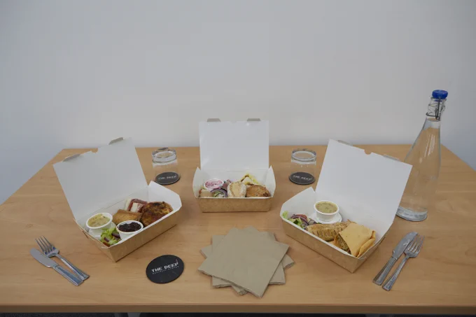 3 lunchboxes on a table in The Deep Business Centre Conference Room