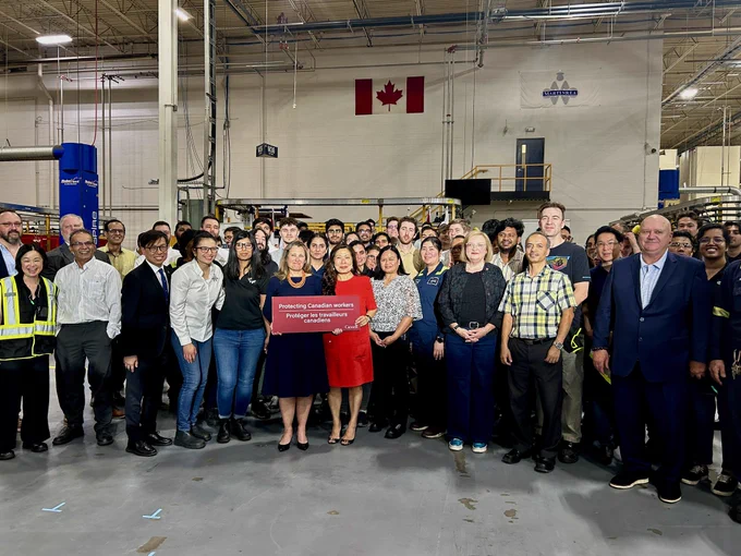The Deputy Prime Minister and Minister Mary Ng with a large group of workers at Alfield Industries in Woodbridge, ON.