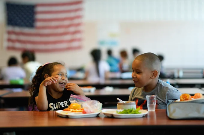 Two children having lunch.