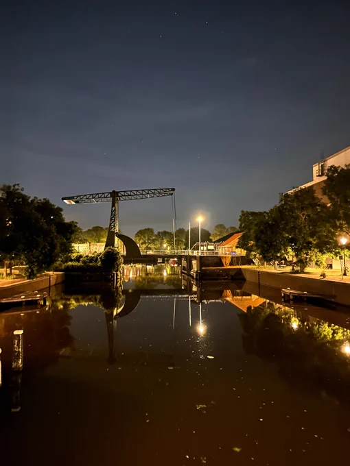A drawing bridge in Amsterdam at night