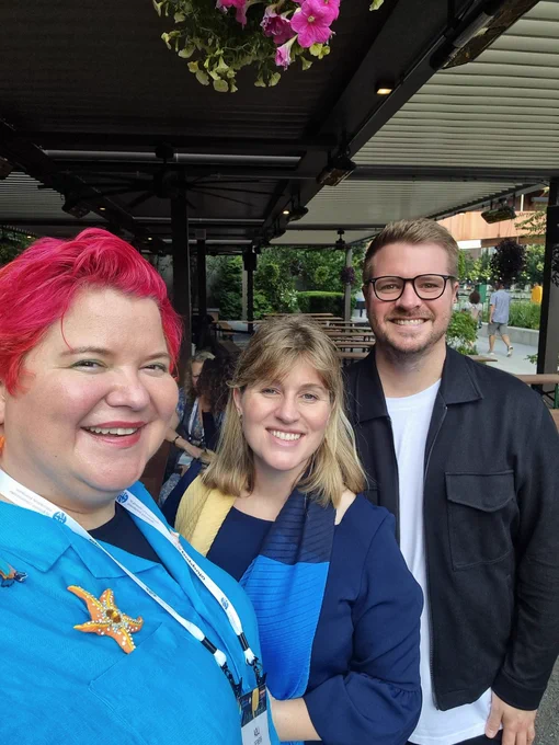 Three communication professionals well lit on a summer's evening