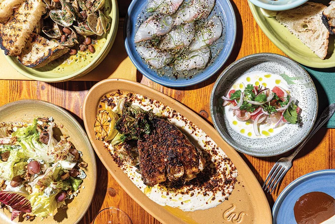 A photo of plates of seasonal seafood from Mabel's Gone Fishing, a restaurant in San Diego