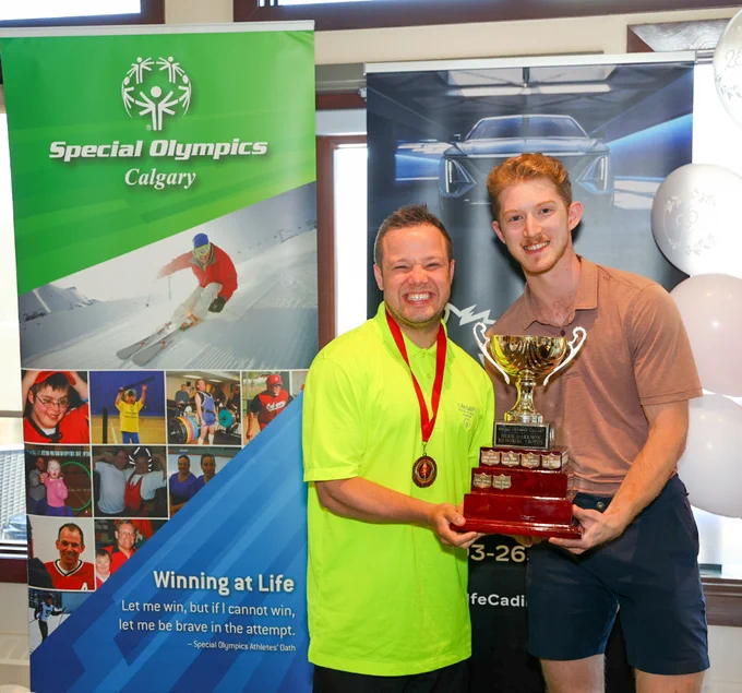Special Olympics athlete David Nicholson and Dustin Wolf with the trophy