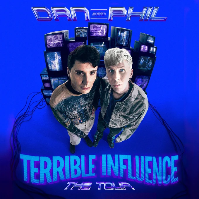 2 men standing in front of a wall of TVs. Text reads Dan and Phil Terrible Influence The Tour
