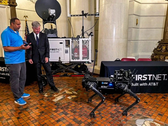 The FirstNet Authority's Dave Buchanan looks at a FirstNet powered robot dog 