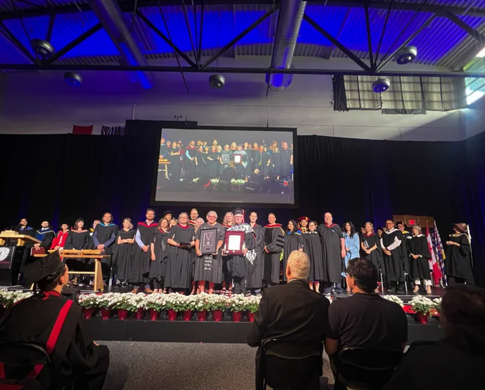 Wendy McNeney, Cruthers’ mother, accepting her honorary Doctor of Letters award. 