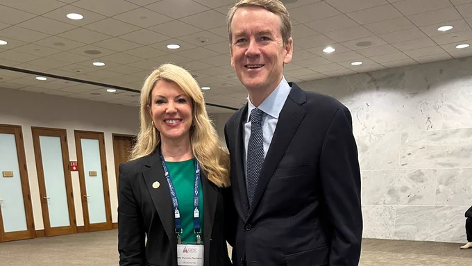President Parsons posing with Senator Michael Bennet. 