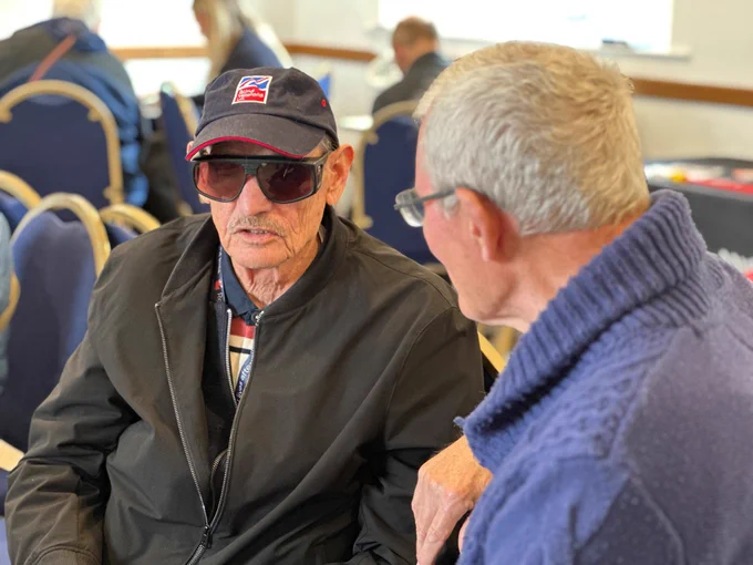 Paul a Trustee from Devon in Sight talking to a Blind Veteran.