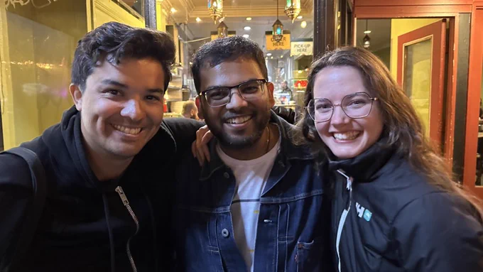 From left to right, César, Vidit, Sofia, smiling at the camera for a picture