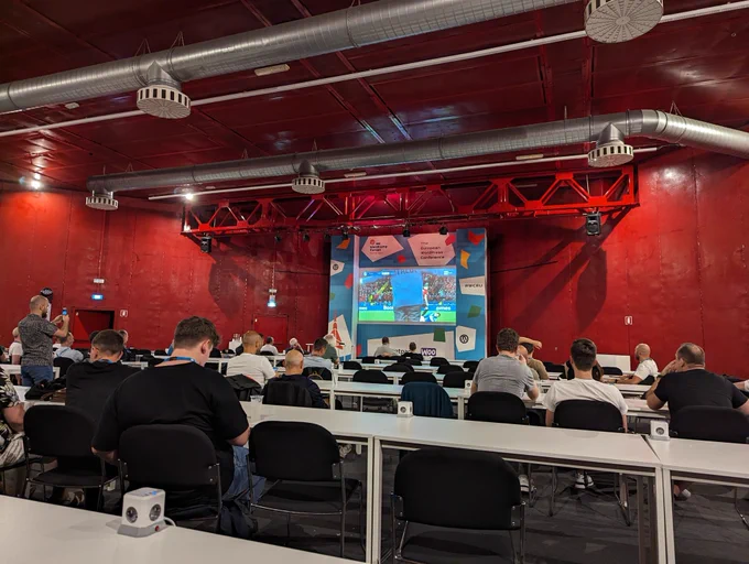 Attendees watching Italy/Albania at the WordCamp Europe afterparty 