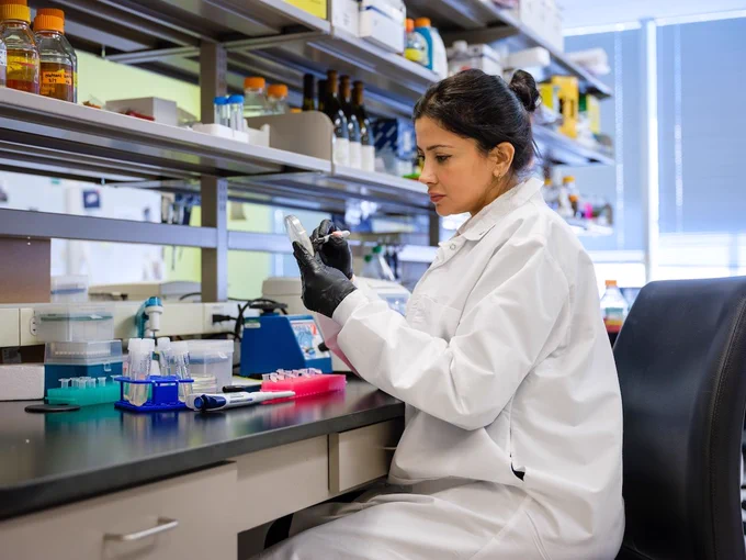 A scientist working in a lab.