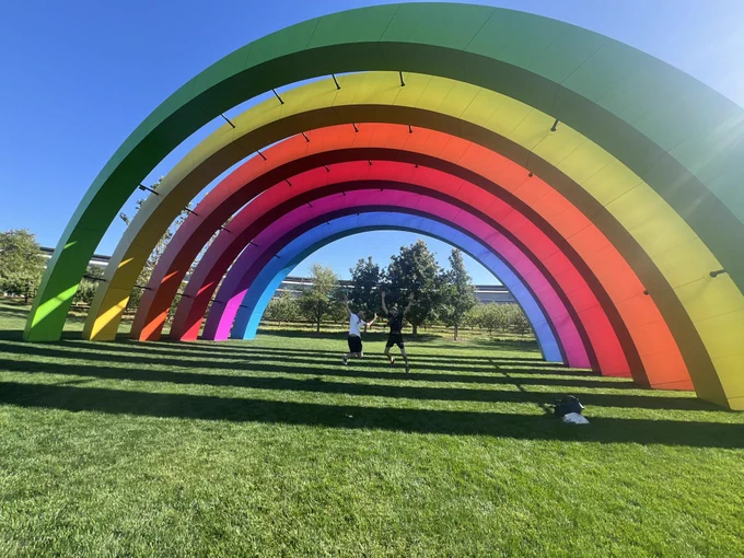 Me and Frederik jumping underneath the Rainbow sculpture at Apple Park