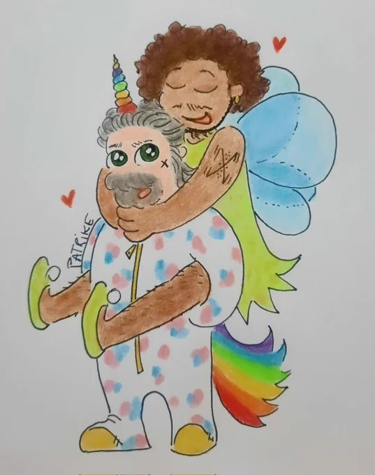 Izzy dressed as a unicorn, blue, pink and white skin and rainbow-colored horn and tail. Roach dressed as a fairy with a green dress and shoes, and blue wings 