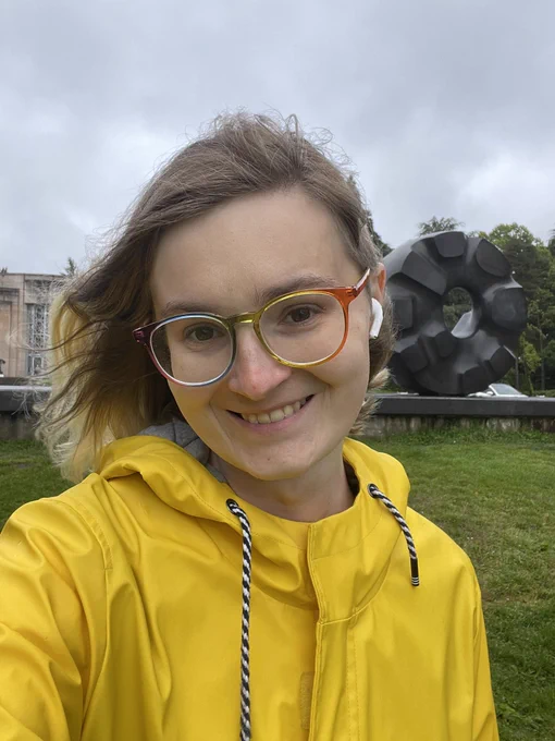 claire wearing a yellow raincoat and smiling