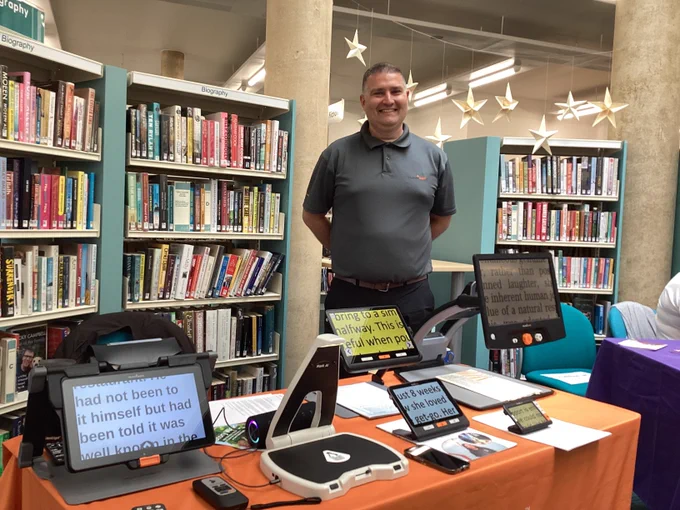 Humanware team member displaying screen reading technology