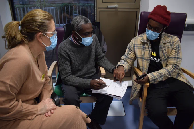 Dr Francis Amafu-Dey (centre) attended the ICAP programme in December 2022. Pictured with specialist speech and language therapist Luisa Zenobi-Bird (left) and his son Delali (right). Photo credit Marie Mangan