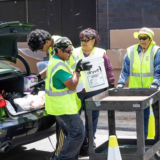 Emptying HHW out of a car trunk at an event