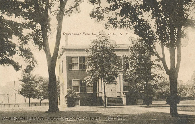 Black and white postcard of a library building.