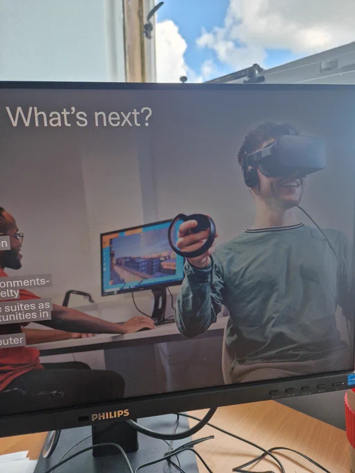 A screenshot of one of my slides containing what's next title and a smiling learner with virtual reality headset.