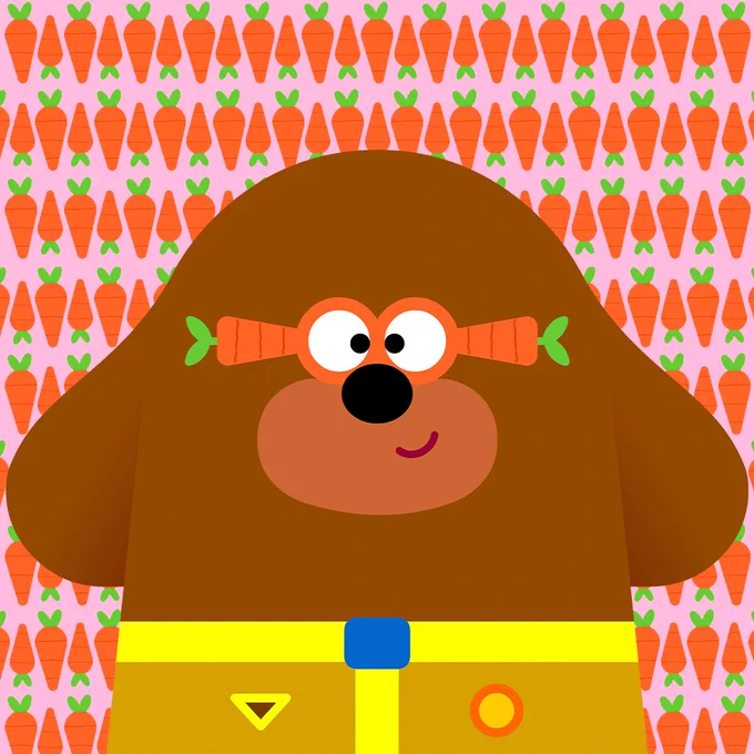 Duggee is wearing carrot glasses and stands in front of a patterned carrot-and-pink-background
