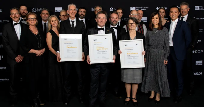 Tristram Collett, Associate Director Planning and Development, Chief Property Officer Simon Neale and Adrienne Cleland, Deputy Vice-Chancellor Operations and Registrar, hold the awards the University's B201 received at the Property Council NZ's Property Industry Awards on 14 June, 2024. Pictured with lots of people involved in the project. 