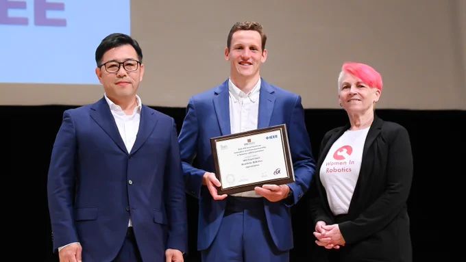 The IERA Award winner 2024 from left: Koji Kobayashi and Will Floyd-Jones, Realtime Robotics; Andra Keay, IERA Awards Chair, IEEE-RAS © IEEE-RAS